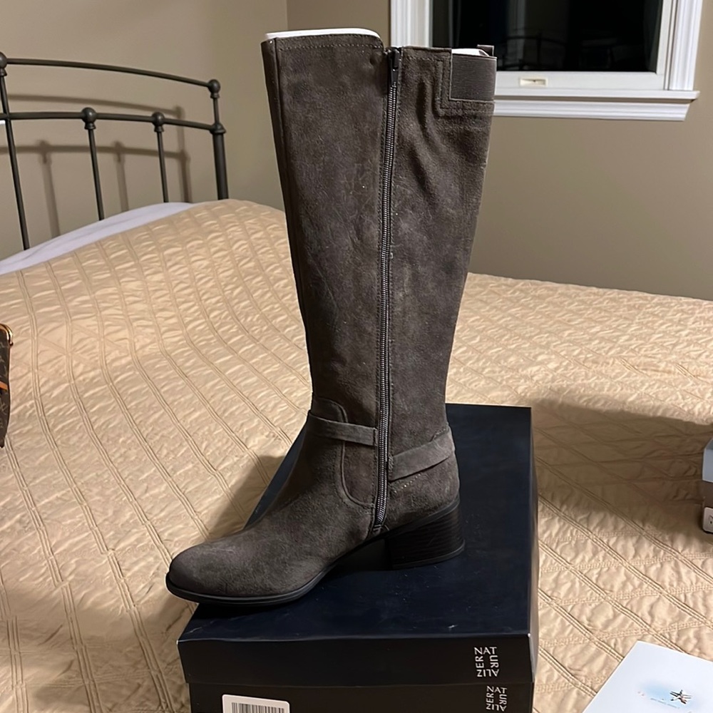 Brand new never worn high calf suede boots.